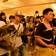 A raccoon was held in hand.